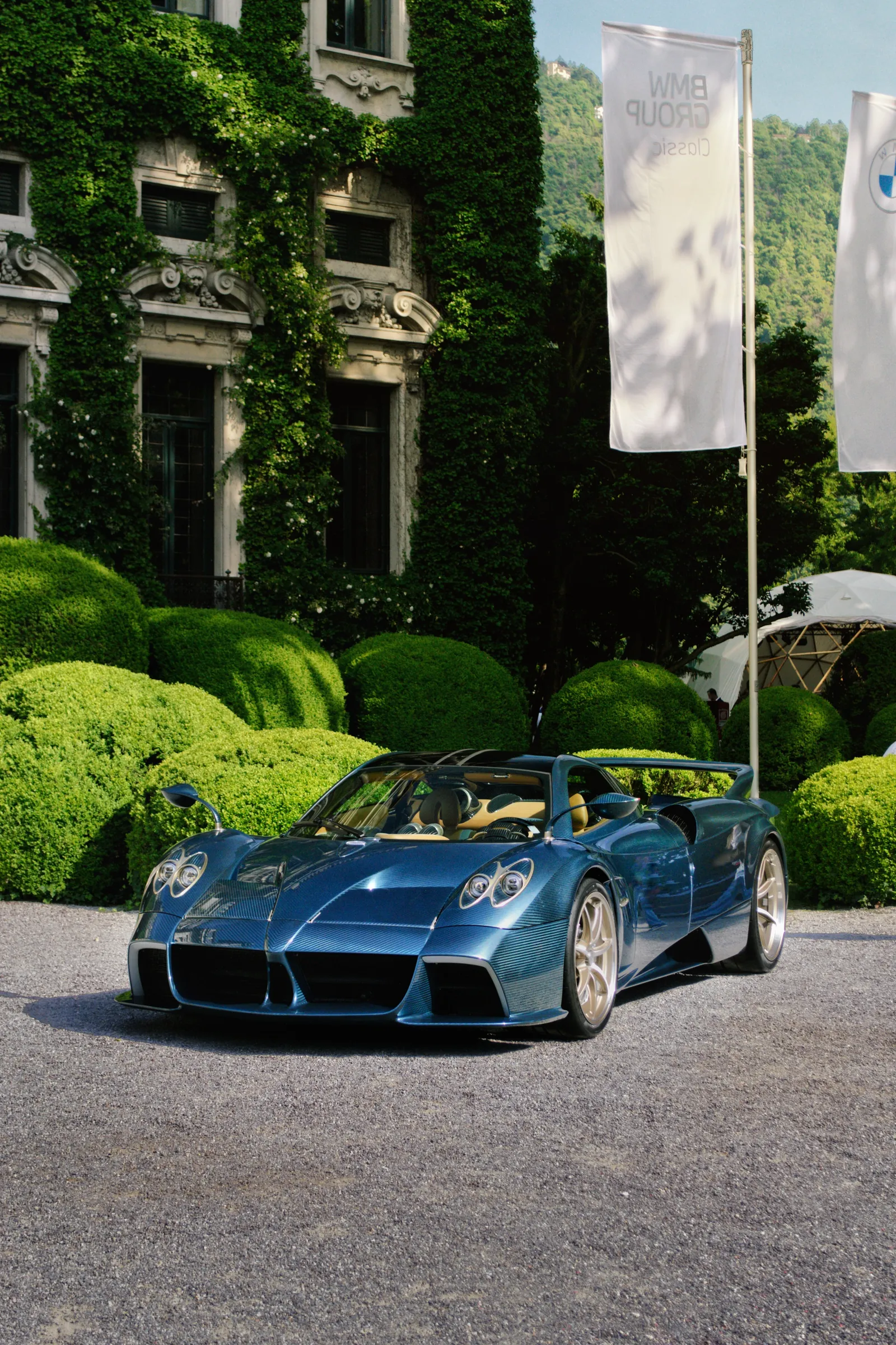 Blue Pagani Huayra Roadster in front of a villa